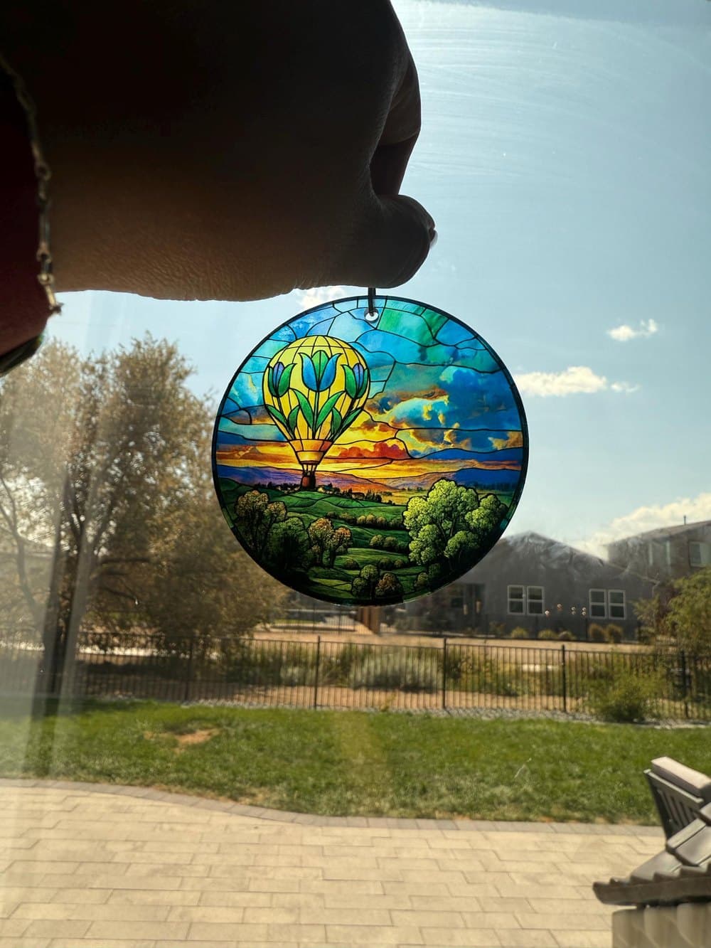 Stained glass style engagement gift suncatcher in a window
