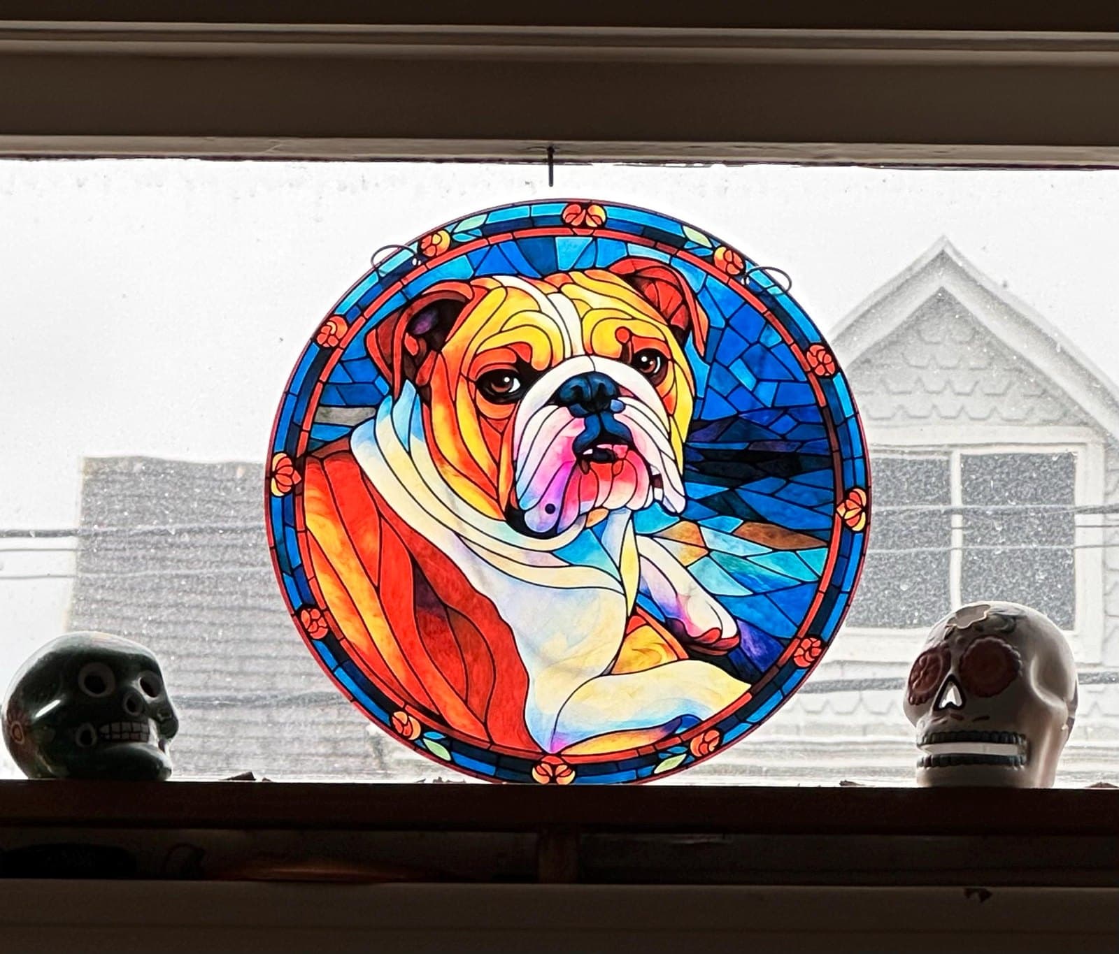 Stained glass style portrait suncatcher glowing in a customer's window